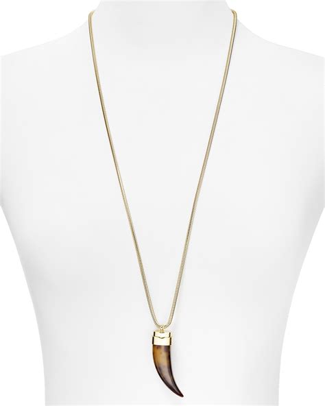 Michael Kors Tortoise horn pendant necklace. 